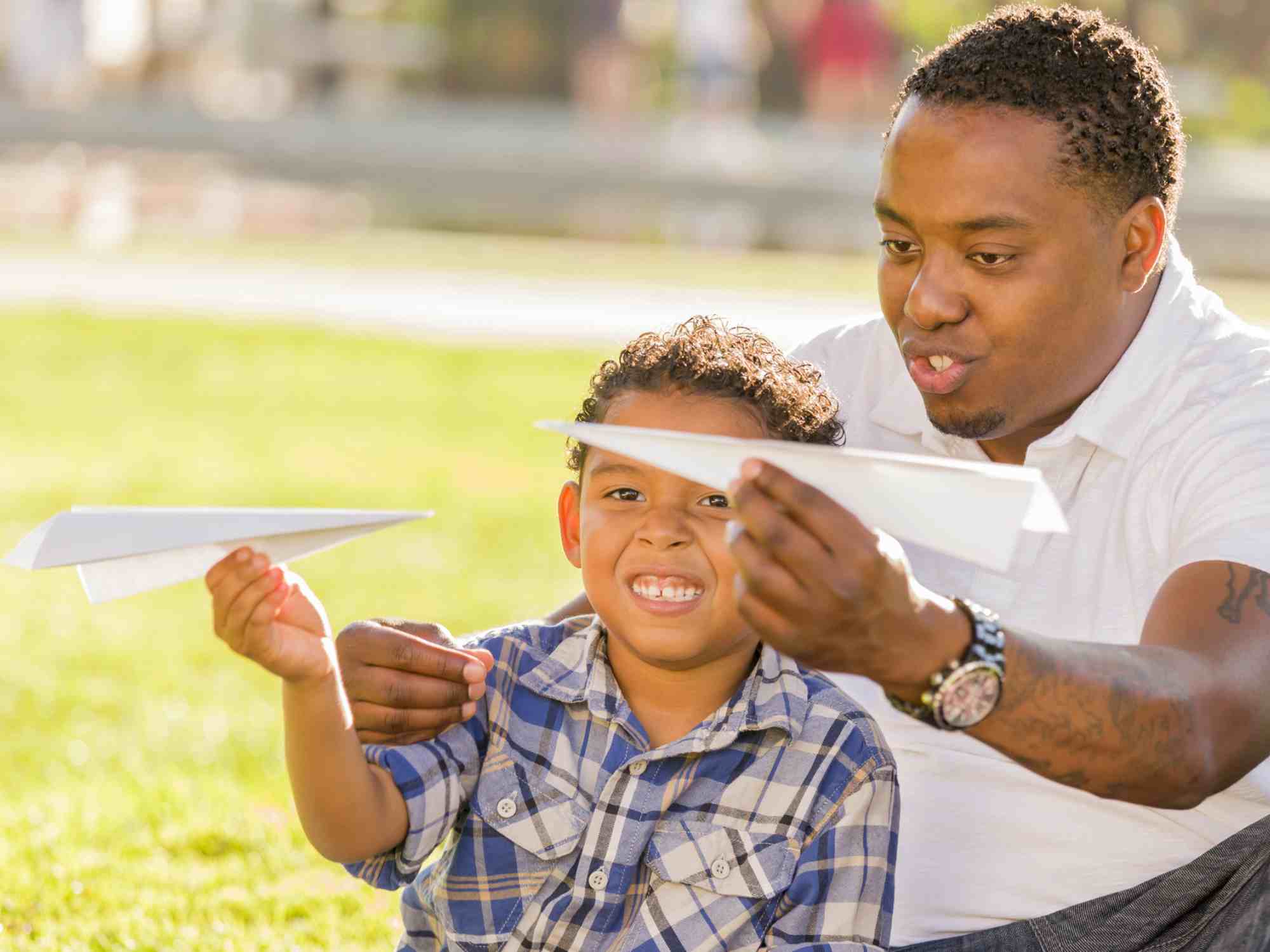 Family with paper airplanes