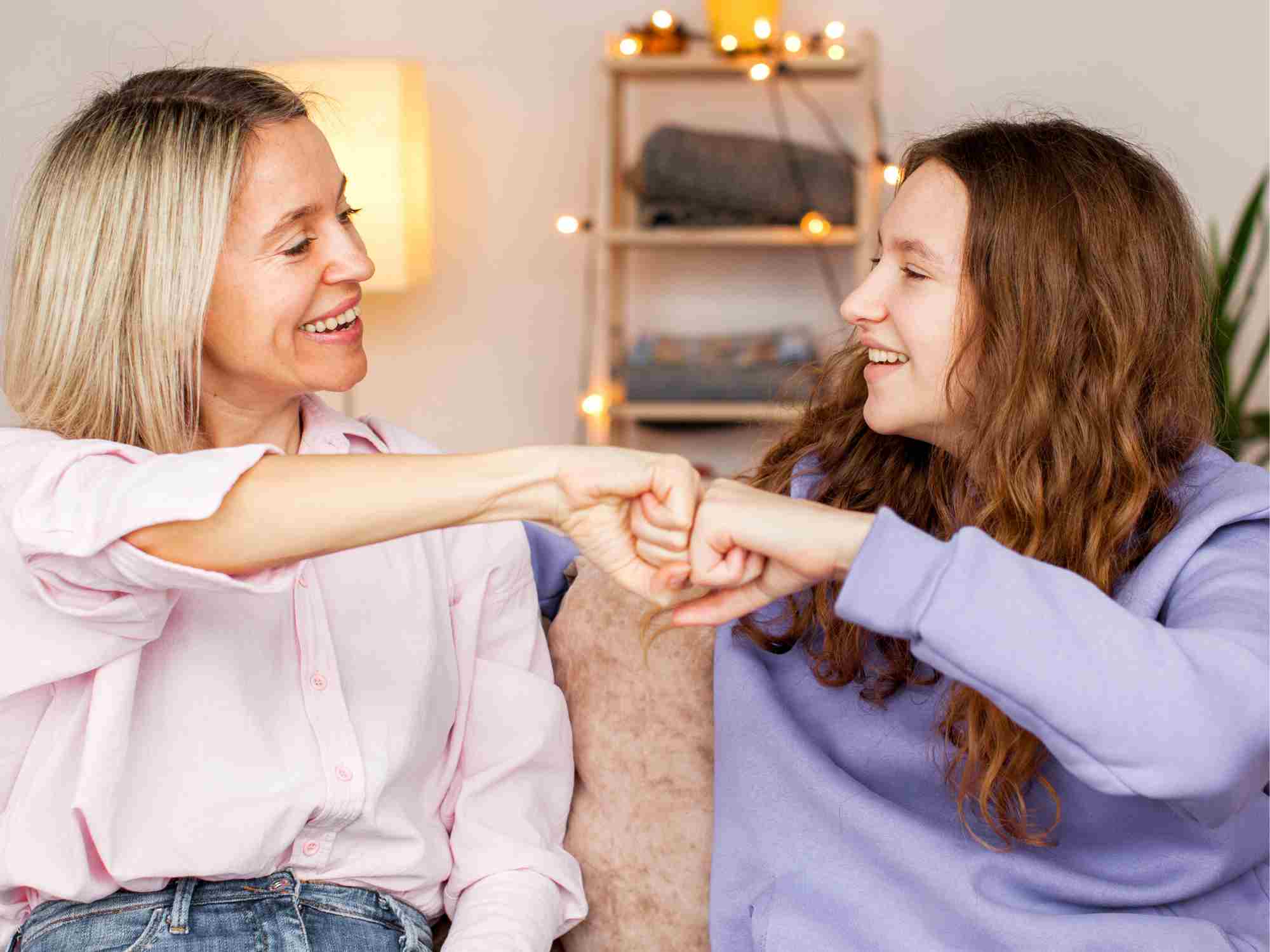 Mom and daughter fist bump