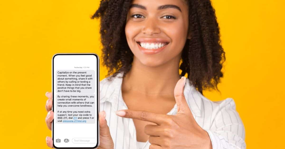 Woman smiling a point and iPhone