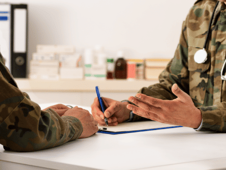 Veteran writing on a piece of paper