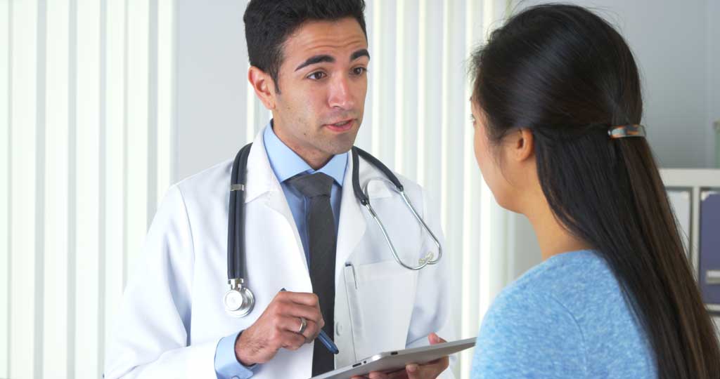 woman talking to her doctor