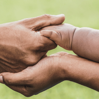 A family embracing hands