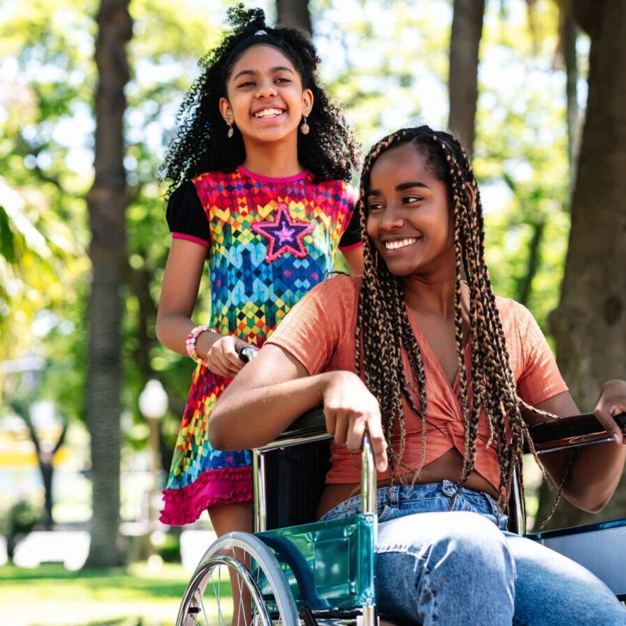 Girl in wheelchair with friend