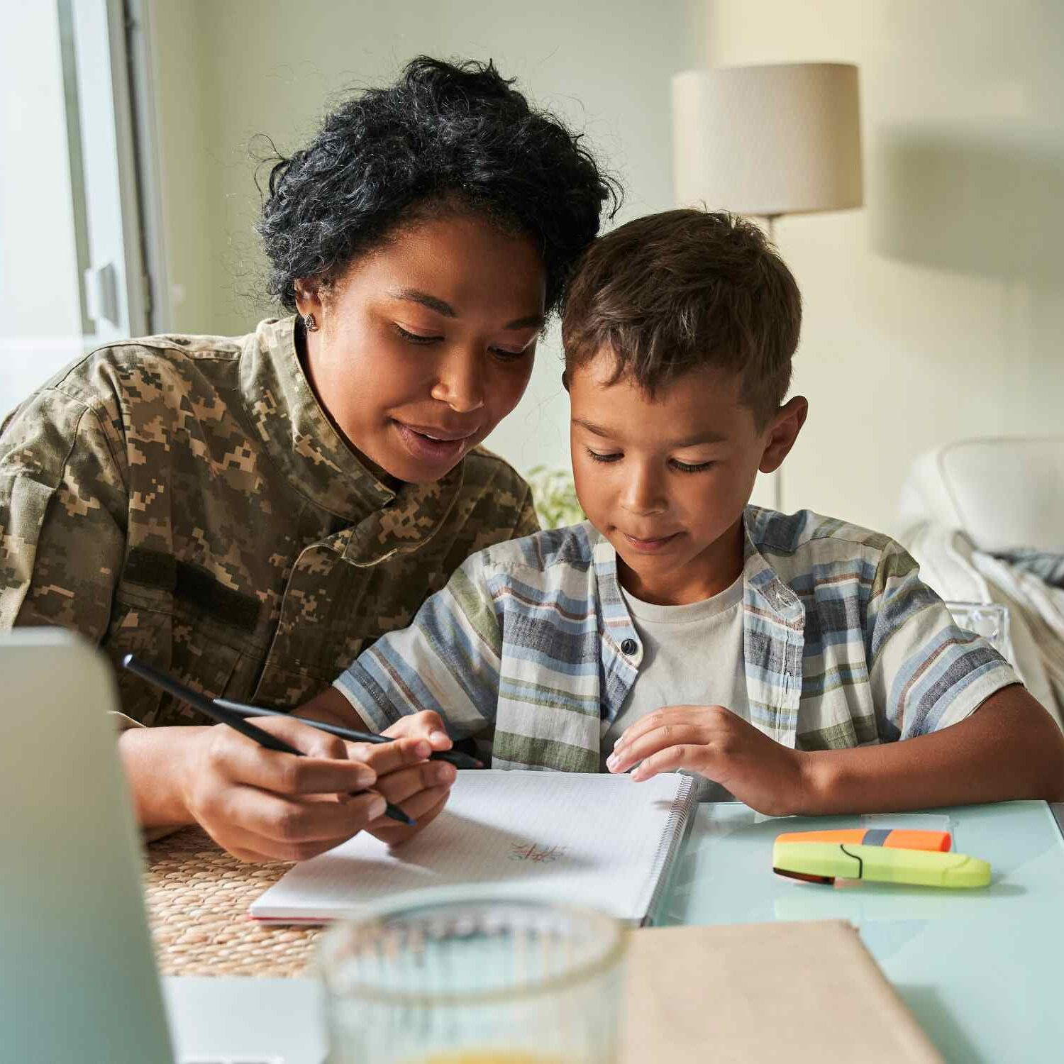 Veteran mom doing homework with son