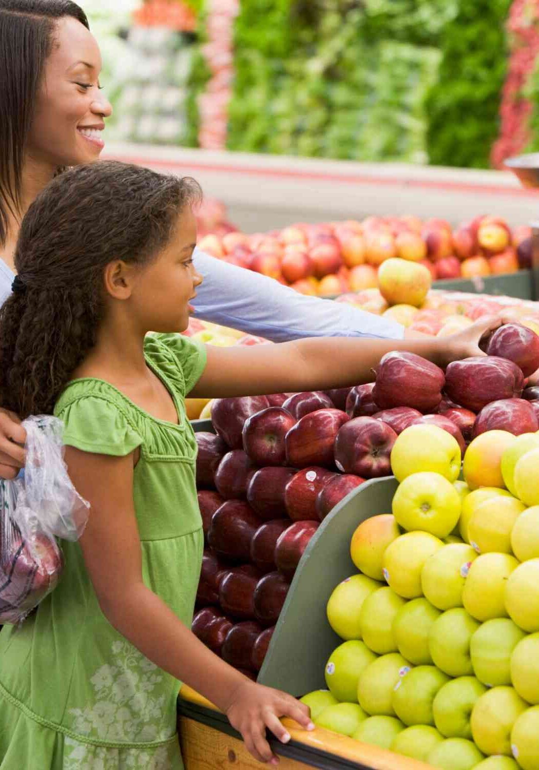 Mom and daughter grocery shopping