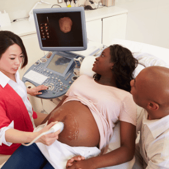 Couple looking at an ultrasound of their baby in the doctor's office