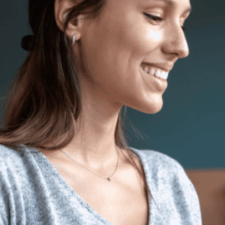 Woman looking at phone and smiling