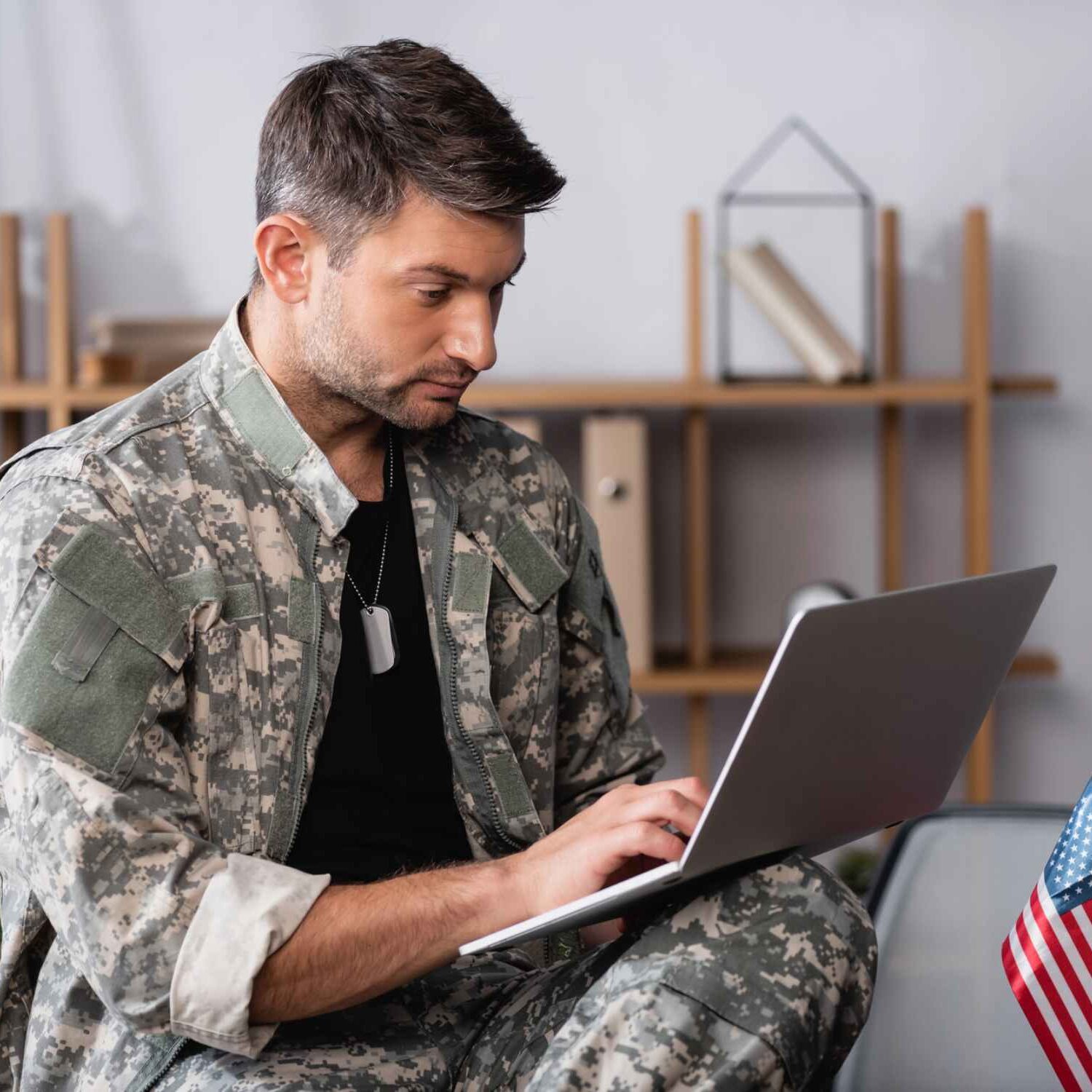 Veteran talking to the crisis line on his computer Veteran talking to the crisis line on his computer