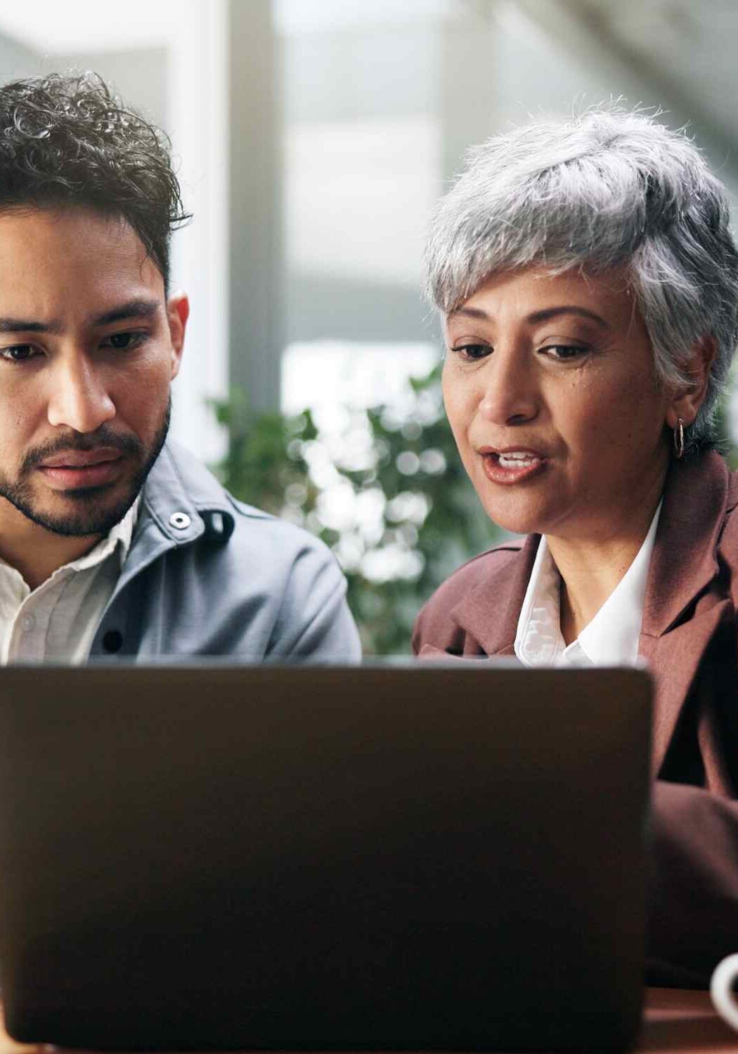 health counselor offering help at computer