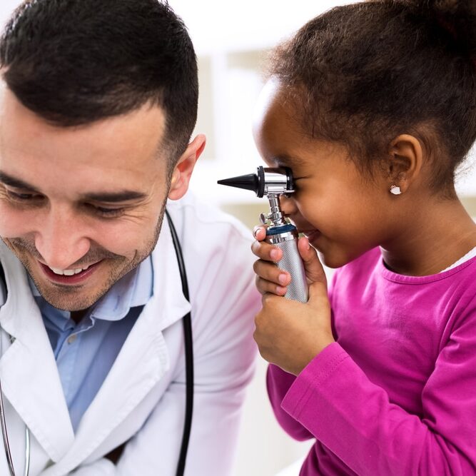 girl playing with doctor