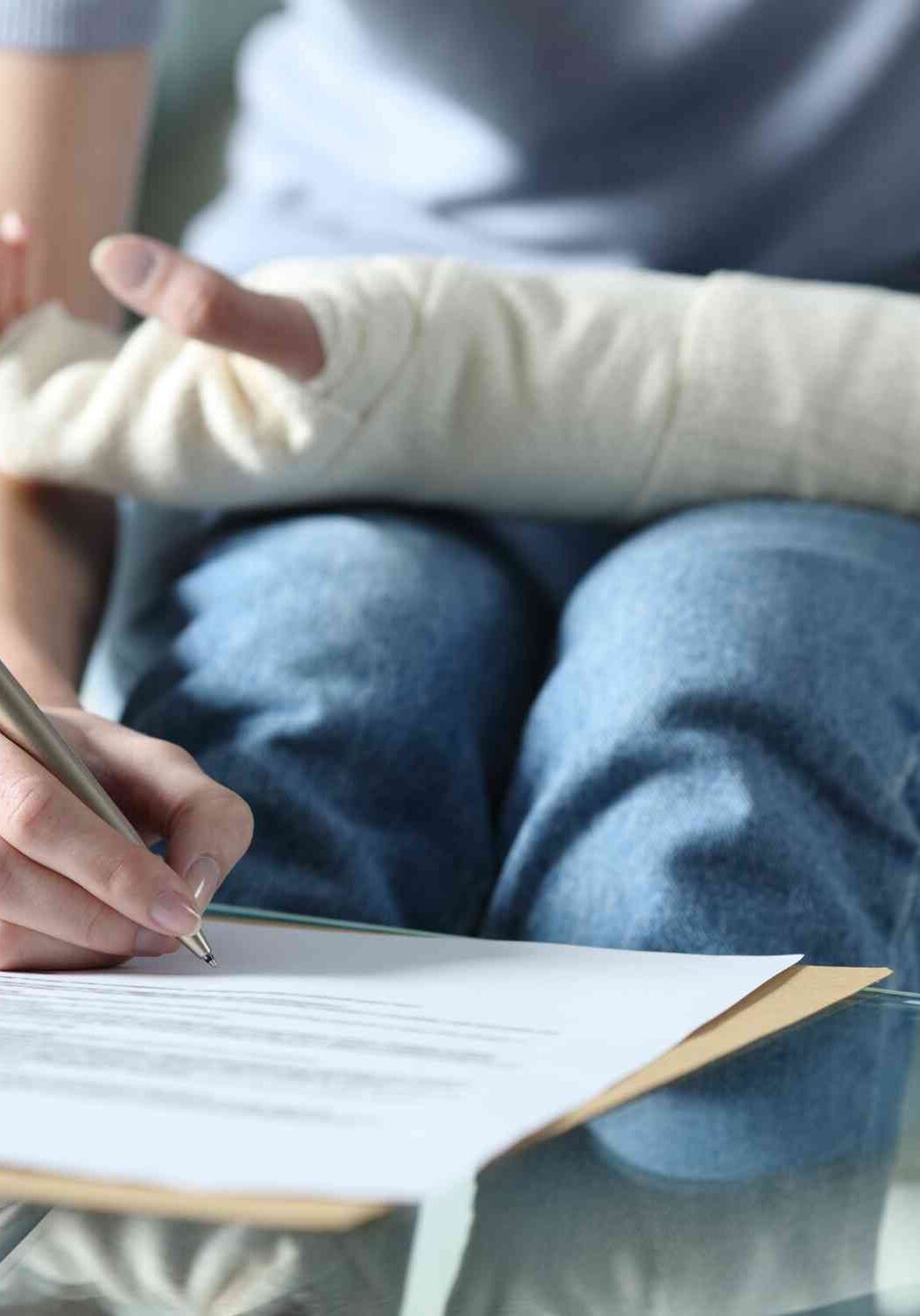 injured person signing legal papers